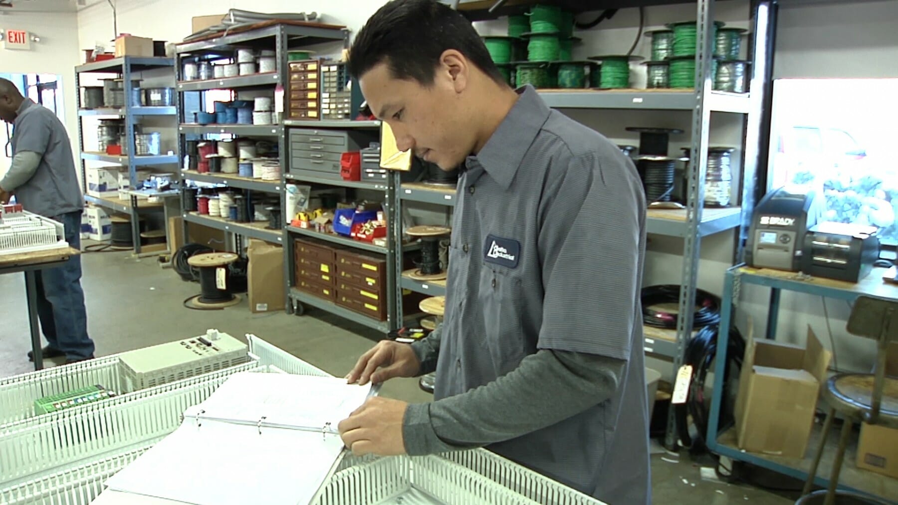 Stock Photo: Engineer working on machine schematics