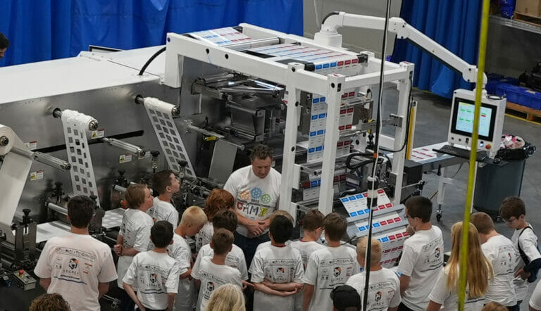 Robotics camp learning about a packager
